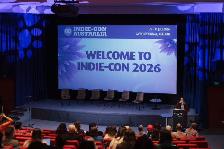 Welcome to Indie-Con Australia 2026 presentation on stage at Mercury Cinema in Adelaide with an audience seated below.